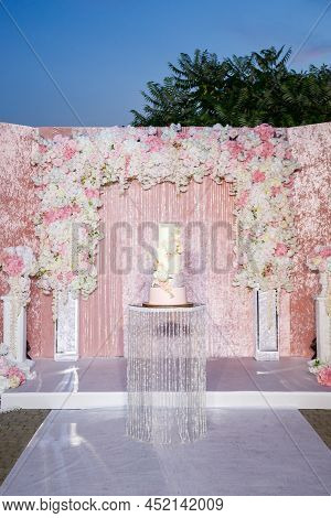 Beautiful Wedding Arch Of Flowers For The Newlyweds. Decoration On A Holiday