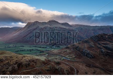 Epic Aerial Drone Landscape Image Of Sunrise From Blea Tarn In Lake District During Stunning Autumn 
