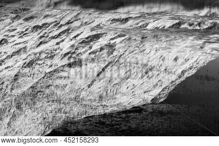 Black And White Beautiful Winter Landscape Image Of Loch Achtriochan In Scottish Highlands With Stun