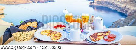 Breakfast For Two With Coffee, Fresh Orabge Juice And Yogurt At Morning By Seaside, Greece, Toned