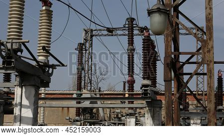 Power Station. Transmission Towers To Provide Energy To A Residential Area. Steel Structures For Gen