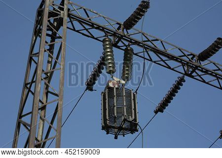 Power Station. Transmission Towers To Provide Energy To A Residential Area. Steel Structures For Gen