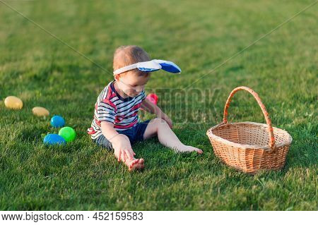 Toddler Eggs Hunters Close-up. Children Activity For Easter In Nature.