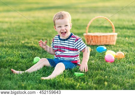 Toddler Eggs Hunters Close-up. Children Activity For Easter In Nature.