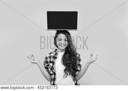 Happy Smart Teen Girl Meditating With Laptop On Head Presenting School Online Lesson, Estudy