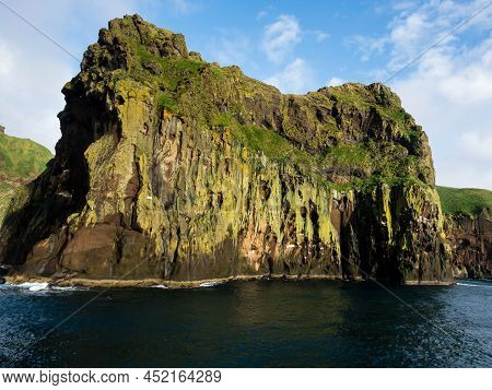 Dramatic Cliffs At The Entrance To Heimaey Harbour On Westman Islands, Iceland