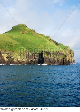 Dramatic Cliffs At The Entrance To Heimaey Harbour On Westman Islands, Iceland