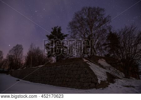 Trongzund Fortress Ruins At Night Under The Starry Sky. Vysotsk, Leningrad Region, Russia