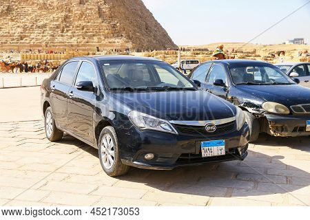 Giza, Egypt - January 26, 2021: Black Chinese Sedan Byd F3 In A City Street Near The Pyramids.