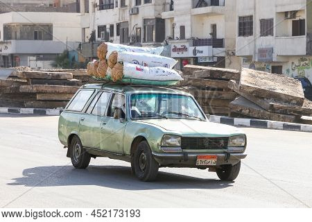 Giza, Egypt - January 26, 2021: Old Estate Car Peugeot 504 In A City Street.