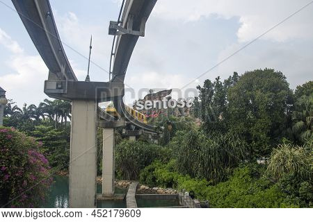 Singapore- Apr 2, 2022: Sentosa Island Sign With The Monorial Pass Through.