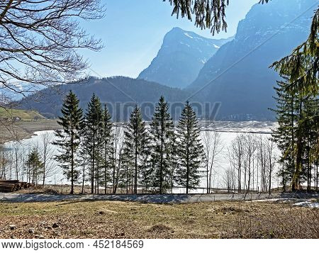 Frozen Klöntalersee Or Klontaler Lake During Early Spring In The Alpine Valley Klöntal (kloental Or 