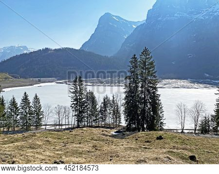 Frozen Klöntalersee Or Klontaler Lake During Early Spring In The Alpine Valley Klöntal (kloental Or 