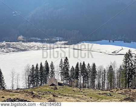Frozen Klöntalersee Or Klontaler Lake During Early Spring In The Alpine Valley Klöntal (kloental Or 