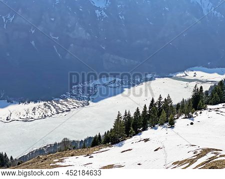 Frozen Klöntalersee Or Klontaler Lake During Early Spring In The Alpine Valley Klöntal (kloental Or 