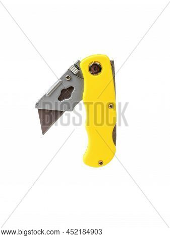 A Half-folded Paper And Cardboard Knife Isolated On A White Background. Manual Cutting Tool.