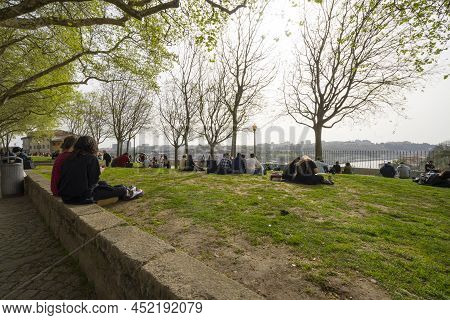 Porto, Portugal. March 2022.  People Relax Admiring The Panorama Of The City On The Virtudes Park