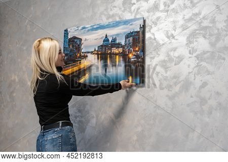 Photo Canvas Print. A Woman Holding A Photography With Gallery Wrap. Photo Printed On Glossy Synthet