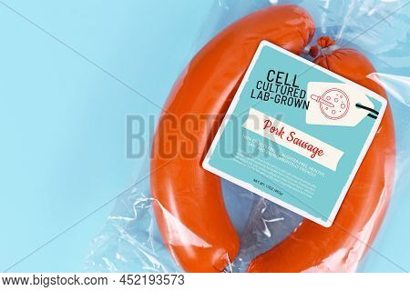 Lab Grown Cell Cultured Meat Concept For Artificial Meat Shwoing Packed Pork Sausages With Made Up L