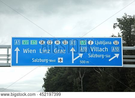 Motorway Junction With Large Signs Indicating The Border Towns In Austria And Italy And Wien Capital