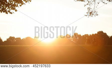 Couple Of Young Lovers On The Right Backlit With Intentionally Bright Effect