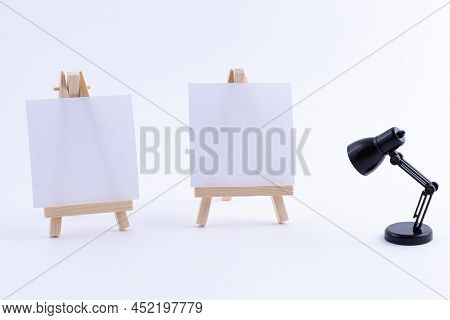 Two Wooden Easels Miniature With Blank White Square Canvas For Artists And Painters - Mockup. Mini W