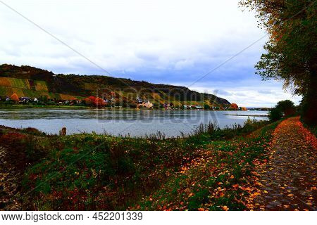 Waterfront Path On Namedyer Werth In Autumn With A View To The Vineyards Above Leutesdorf