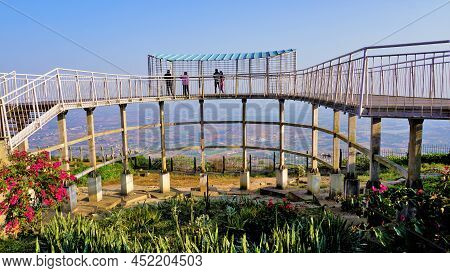 Tourist Enjoying Beautiful View From Top Of Nandi Hills