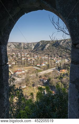 View From A Window In The Fortress In Pocitelj Medieval Village With New Bridge Being Built In The B