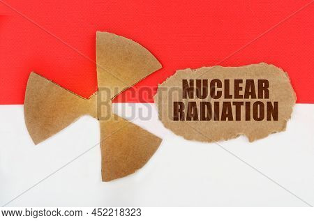 The Concept Of Industry And Radiation. On The Flag Of Indonesia, The Symbol Of Radioactivity And Tor