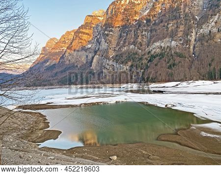 Thawing A Frozen Lake Klöntalersee Or Klontaler Lake During Early Spring In The Alpine Valley Klönta
