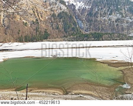Thawing A Frozen Lake Klöntalersee Or Klontaler Lake During Early Spring In The Alpine Valley Klönta