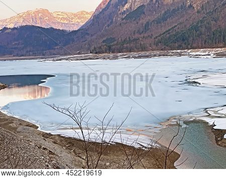 Thawing A Frozen Lake Klöntalersee Or Klontaler Lake During Early Spring In The Alpine Valley Klönta