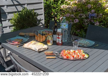 Primelin - France, August 21, 2019 : Table For Lunch In A Garden During Summer