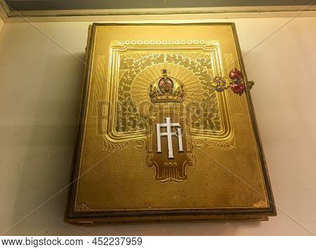 Corfu, Greece - July 3, 2018: Gold-bound Book From The Achilleion Palace Built By Empress Elisabeth 