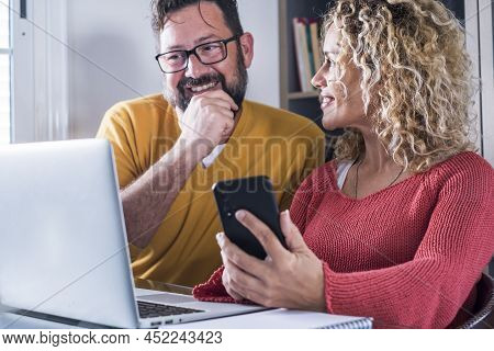Happy Man And Woman Couple Work At Home In Smart Working Office Activity Together With Joy - Digital