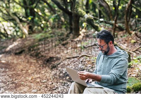 Modern People Working Outdoor With Laptop Computer And Wireless Internet Data Connection. Alternativ