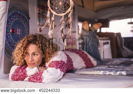Pretty Adult Caucasian Woman Lay Down Inside An Old Classic Van Restored Home Made. Travel Hippy Van