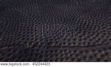 Pattern Landscape With Many Holes To Produce Wine In Volcanic Black Sand Ground. Aerial View Of Alte