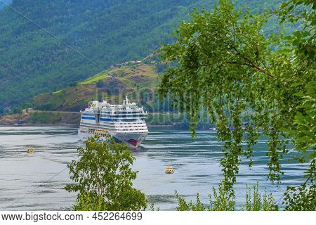 Flam, Norway - July 31, 2018: Norwegian Fjord Sognefjord Landscape And Aidaluna Cruise Ship