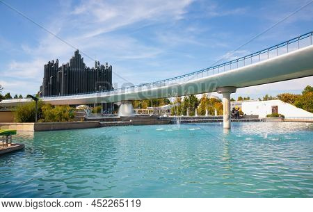 Poitiers, France - September 21 2010: Dynamic Flying Theatre attraction and bridge at Futuroscope.