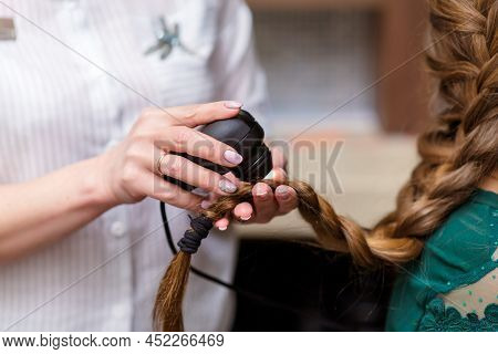 Cropped Unrecognizable Doctor Dermatologist Diagnoses Structure Of Hair Of A Young Woman Using Tool 