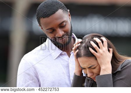 Hypocrite Friend Comforting A Sad Woman In The Street