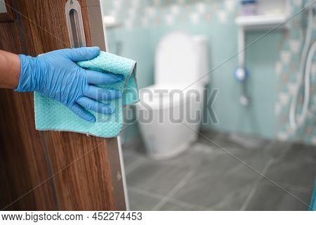 Cleaning Door Toliet Handle At Toilet With Alcohol And Soft Cloth At Office And Home For Protect Cov