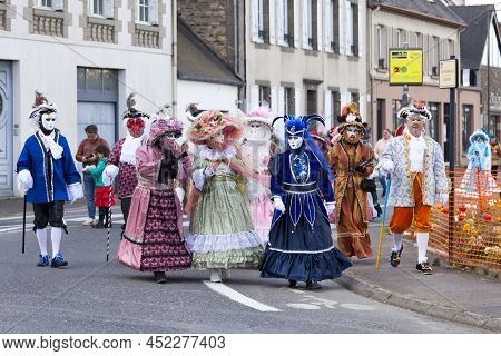 Landerneau, France - April 03 2022: Group Of People Dressed From Head To Toe In Venitian Costumes Du