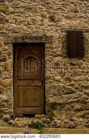 An Old Wooden Door In Poffabro, An Historic Medieval Village In The Val Colvera Valley In Pordenone 