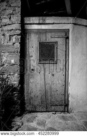 An Old Wooden Door In Poffabro, An Historic Medieval Village In The Val Colvera Valley In Pordenone 