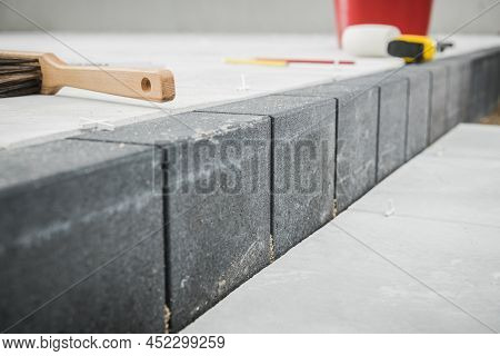 Industrial Theme. Building Concrete Bricks Pathway With Different Levels Close Up.