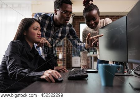 African American Team Leader Pointing Out Unknown Anomalies In Security Network Blockchain Code. Mul