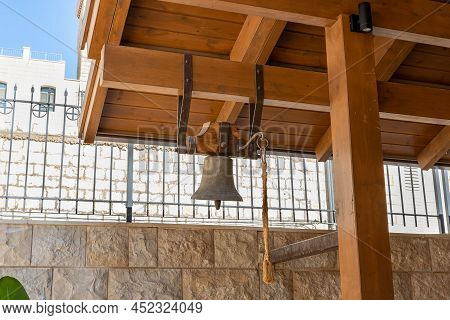 Nazareth, Israel, February 12, 2022 : The Copper Bell Hangs In The Yard Of The Sisters Of Nazareth C